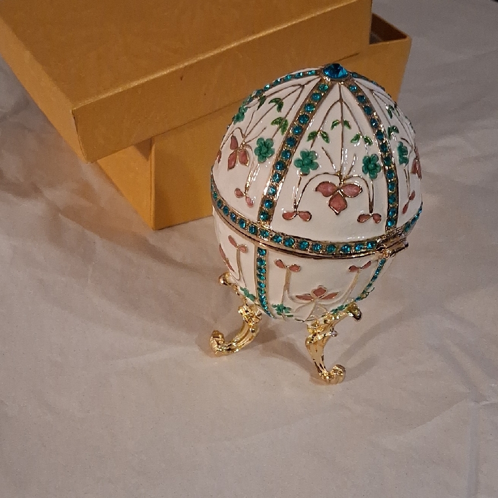 Enamel egg-shaped hand-painted white trinket box with turquoise rhinestones